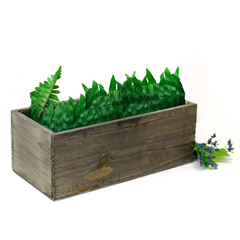 This natural wood garden planter is great for your garden and has a rustic charm. A separated plastic liner can prevent leakage from the planter.
